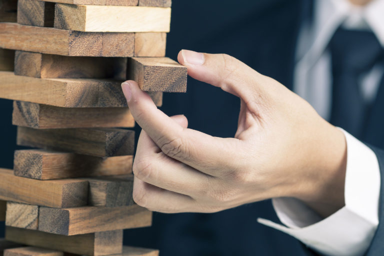 Businessman Builds a Tower